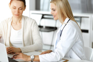 blonde woman doctor with patient