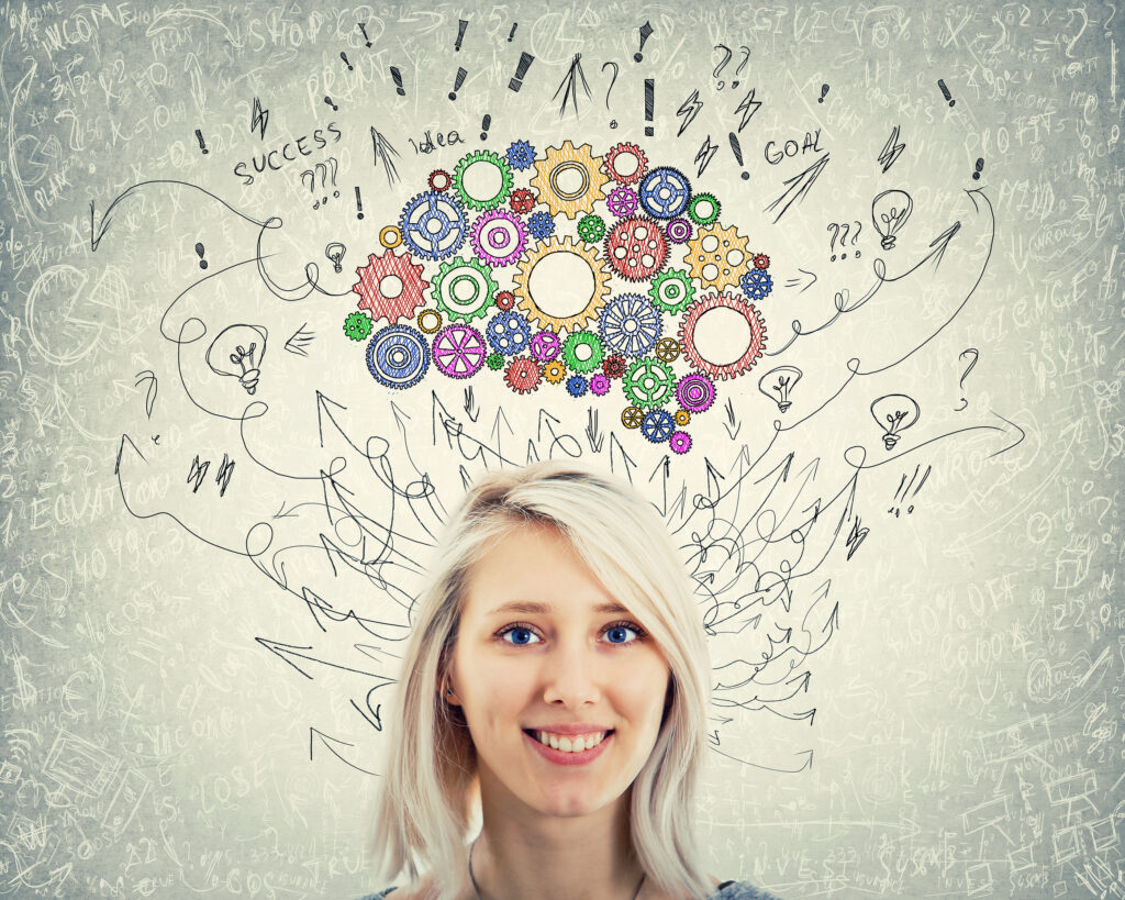 Close up portrait of a young woman with colorful gear brain above head. Happy emotion, positive thinking with arrows and curves as thoughts.